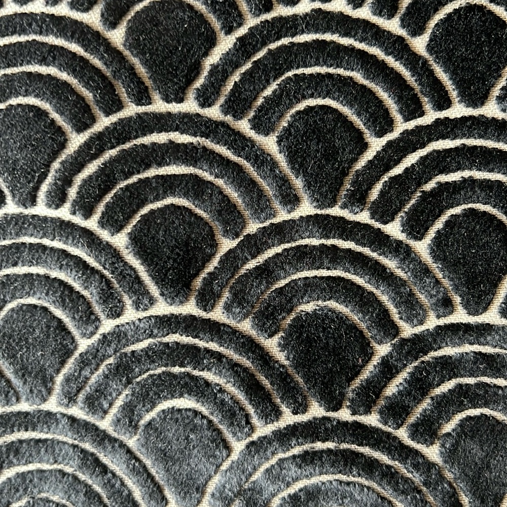 Cut velvet embroidery fabric in a wave pattern.